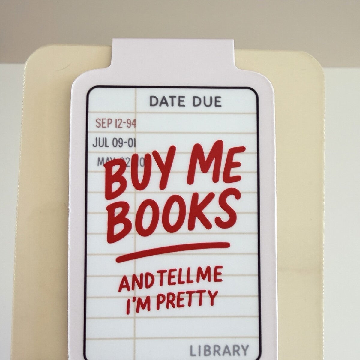 Buy Me Books magnetic bookmark displayed on TinkerLass packaging