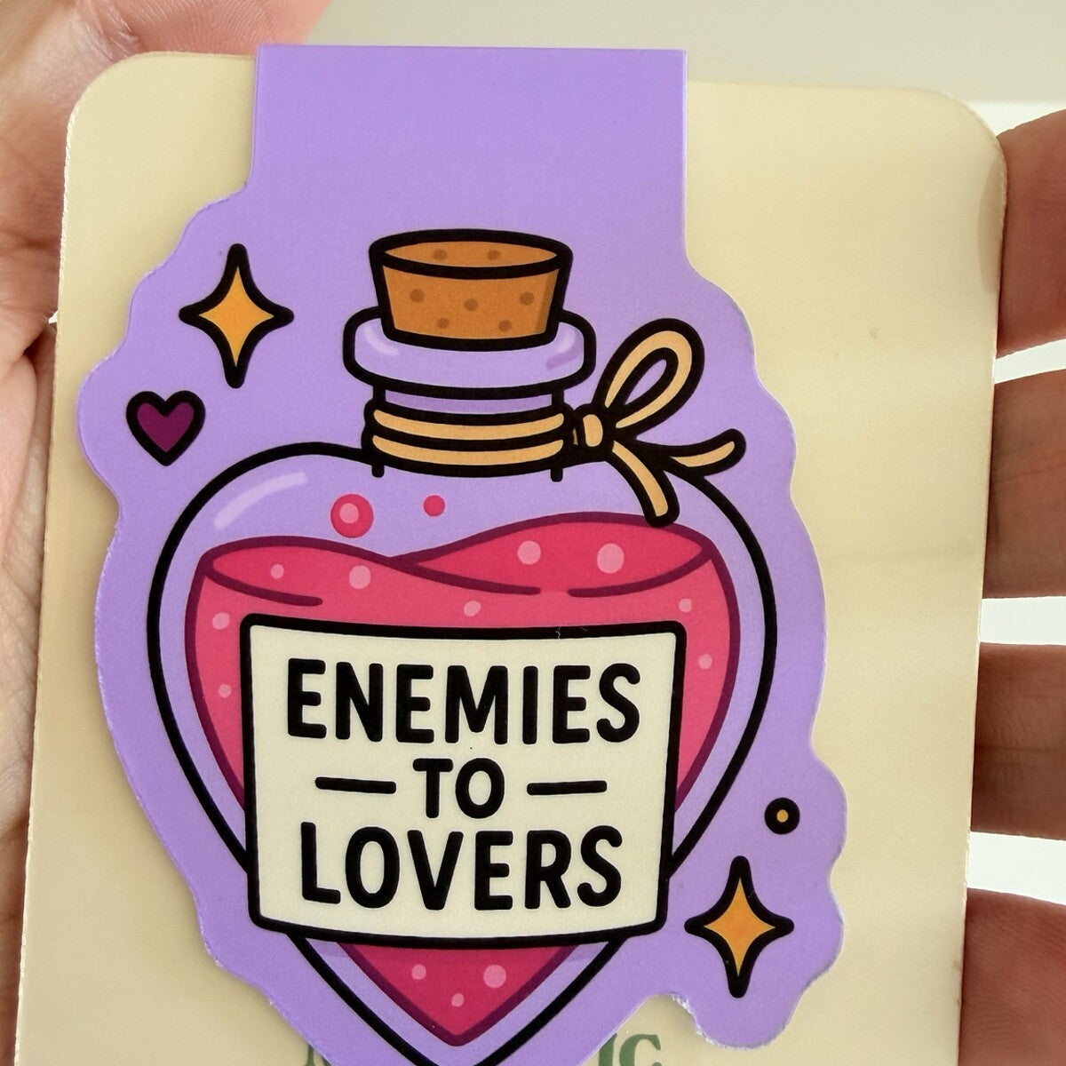 Enemies to Lovers magnetic bookmark displayed on TinkerLass packaging