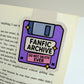 Fanfic Archive magnetic bookmark clipped to an open book page