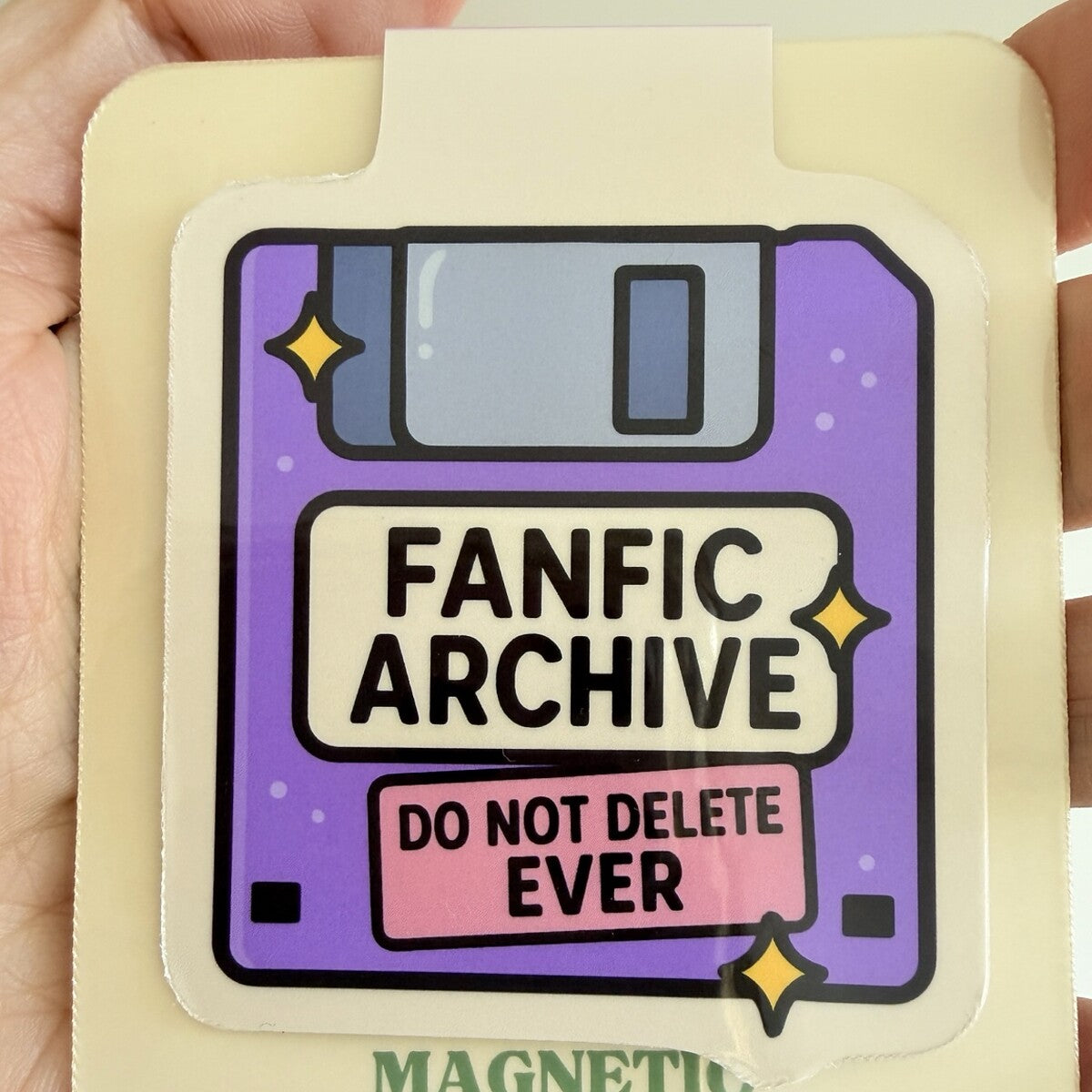 Fanfic Archive magnetic bookmark displayed on TinkerLass packaging
