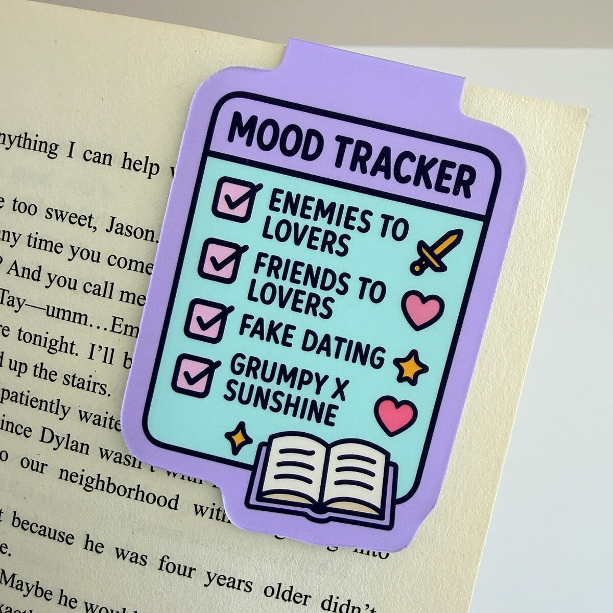 Mood Tracker magnetic bookmark clipped to an open book page